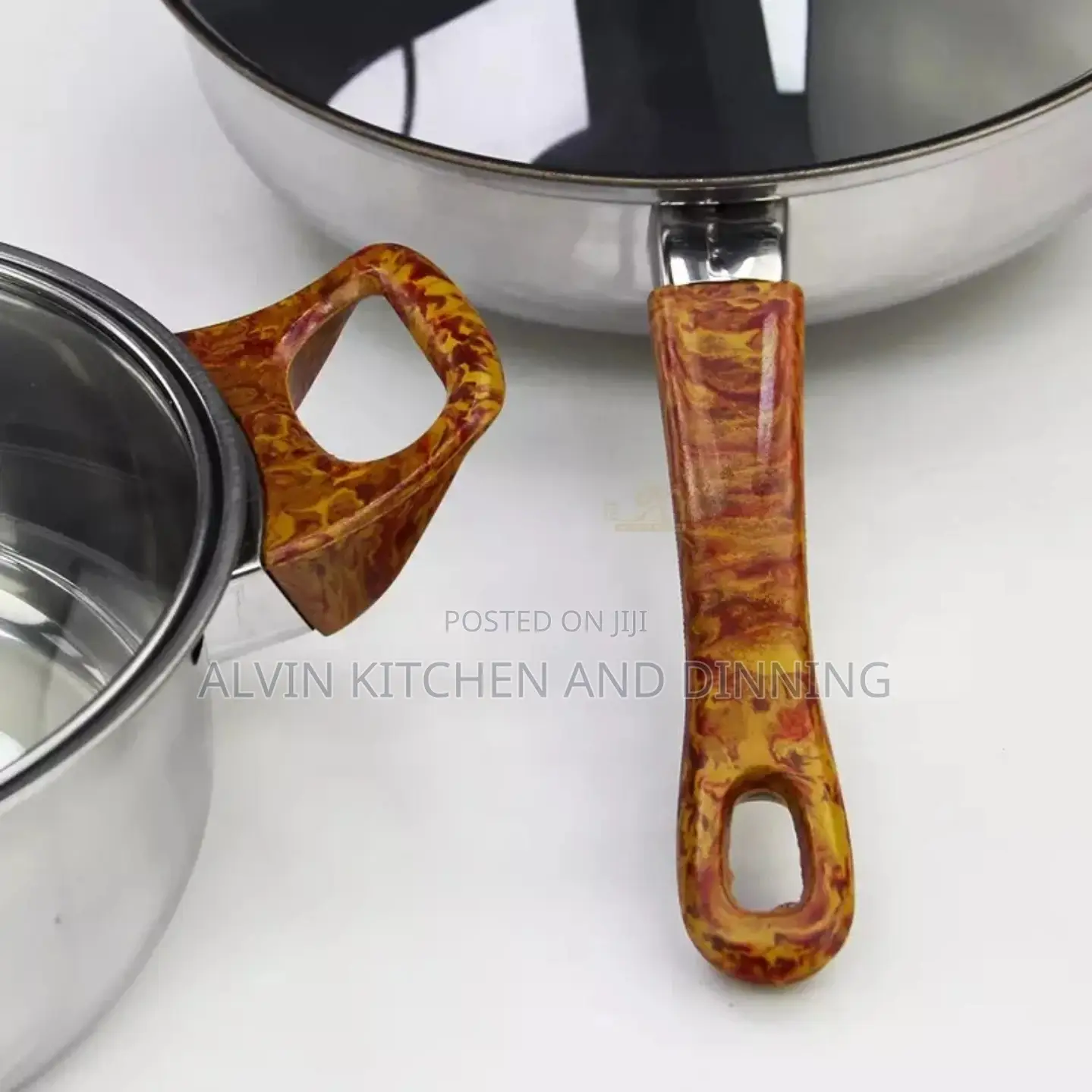Stainless Steel Non-Stick Cookware Set
 a Whistling Kettle