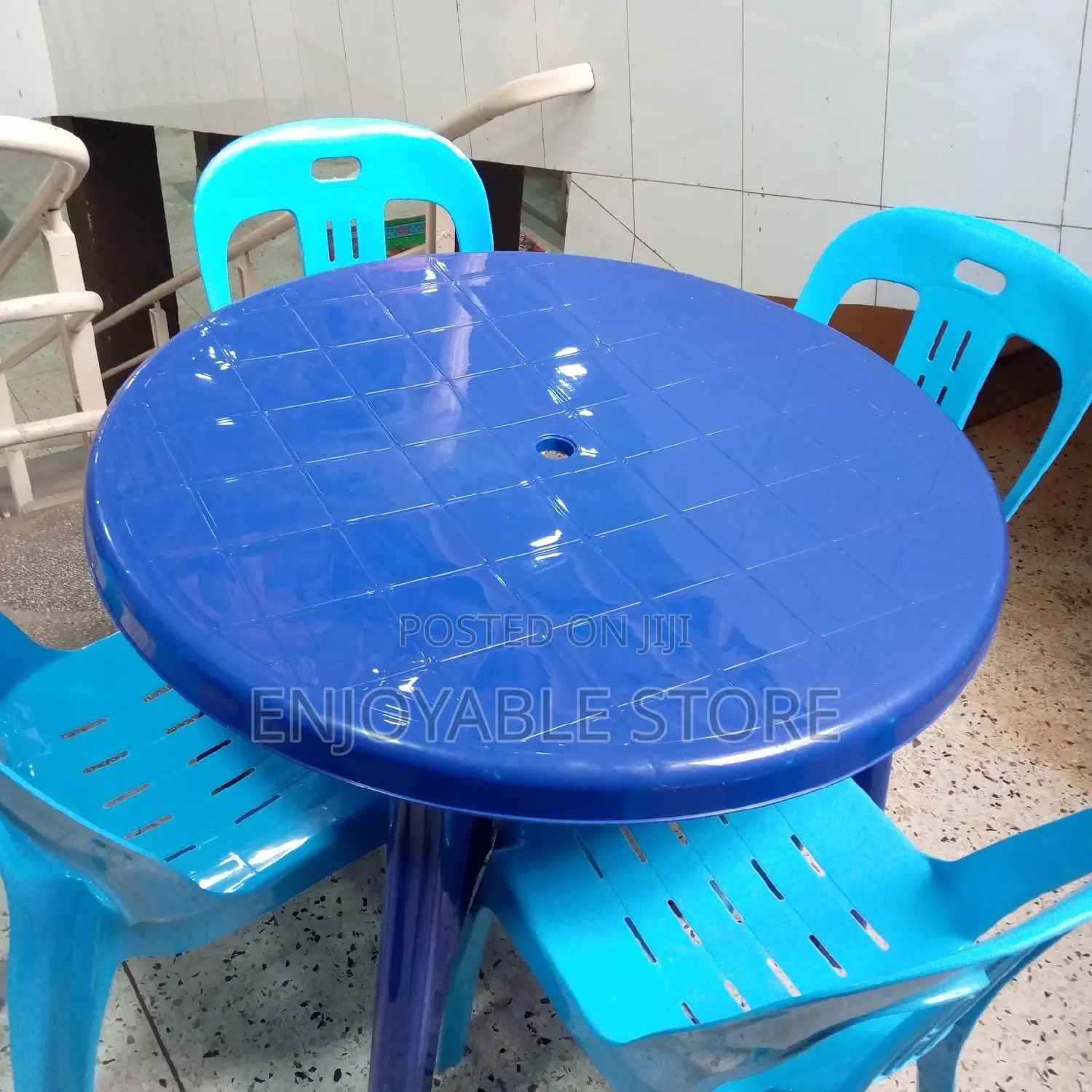 A Set of Plastic 4 Chairs and Table