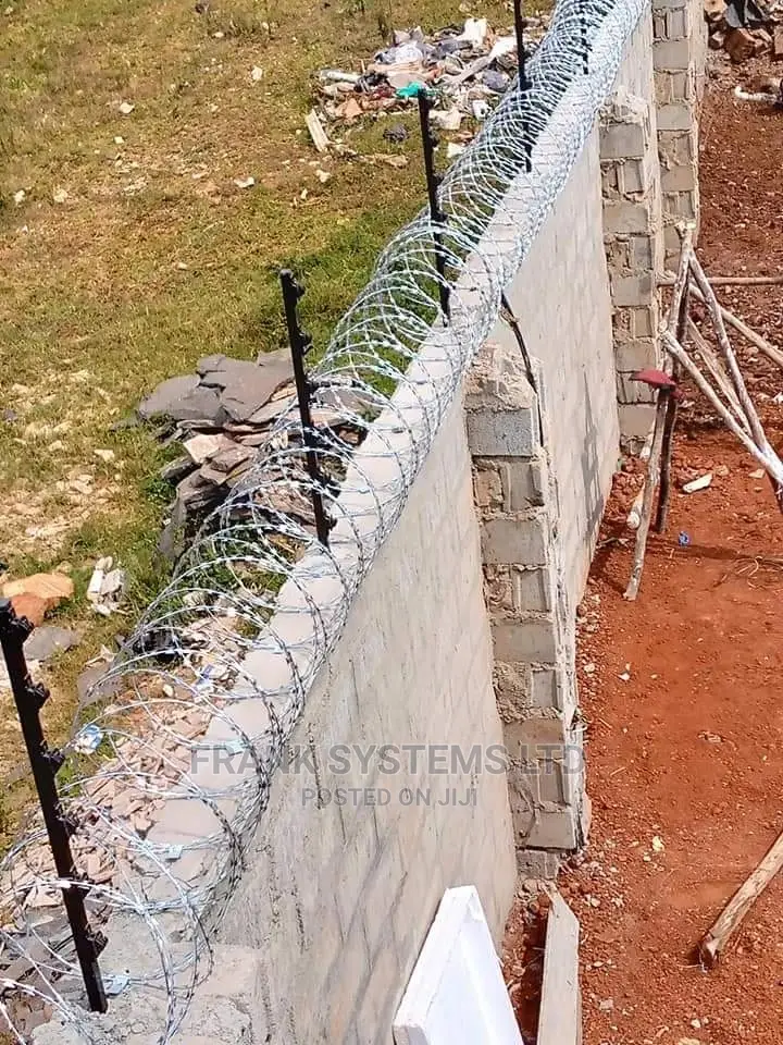 Electric Fence System With Razor Wire. Two In One