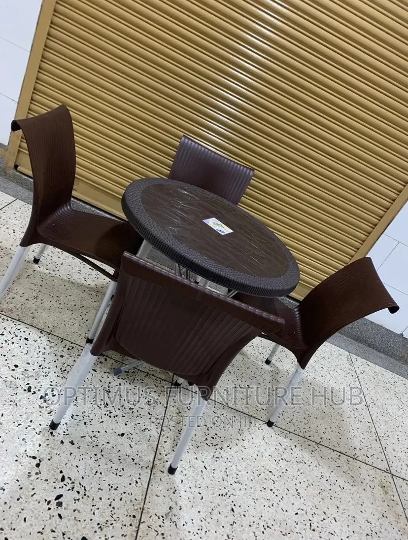 Set of Four Plastic Chairs and Round Table