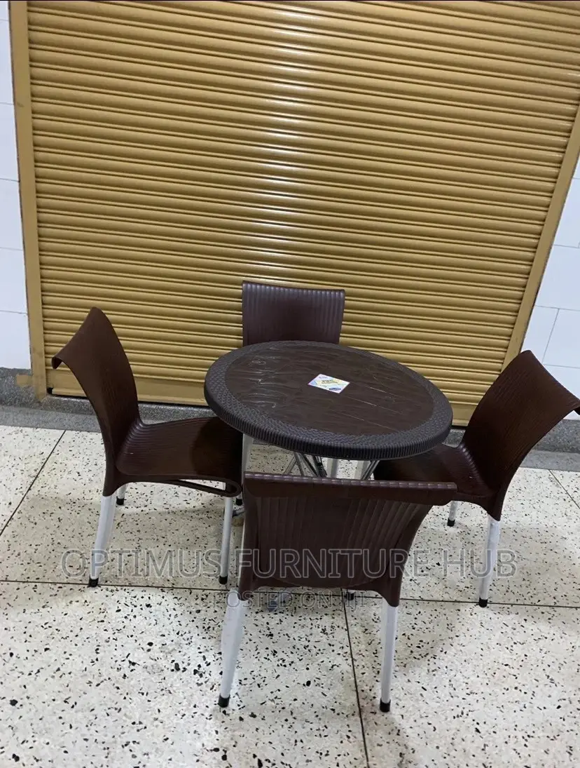 Set of Four Plastic Chairs and Round Table