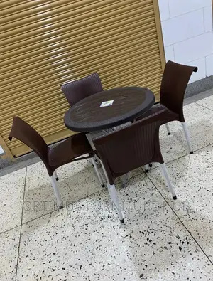 Set of Four Plastic Chairs and Round Table