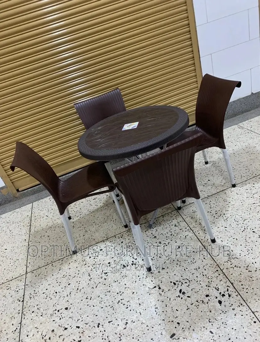 Set of Four Plastic Chairs and Round Table