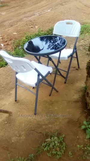A Set of Dining Table and Chairs