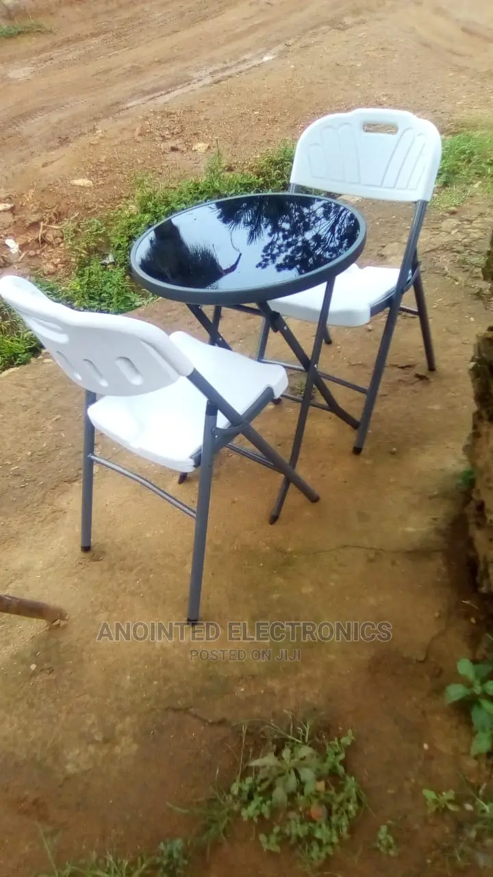 A Set of Dining Table and Chairs