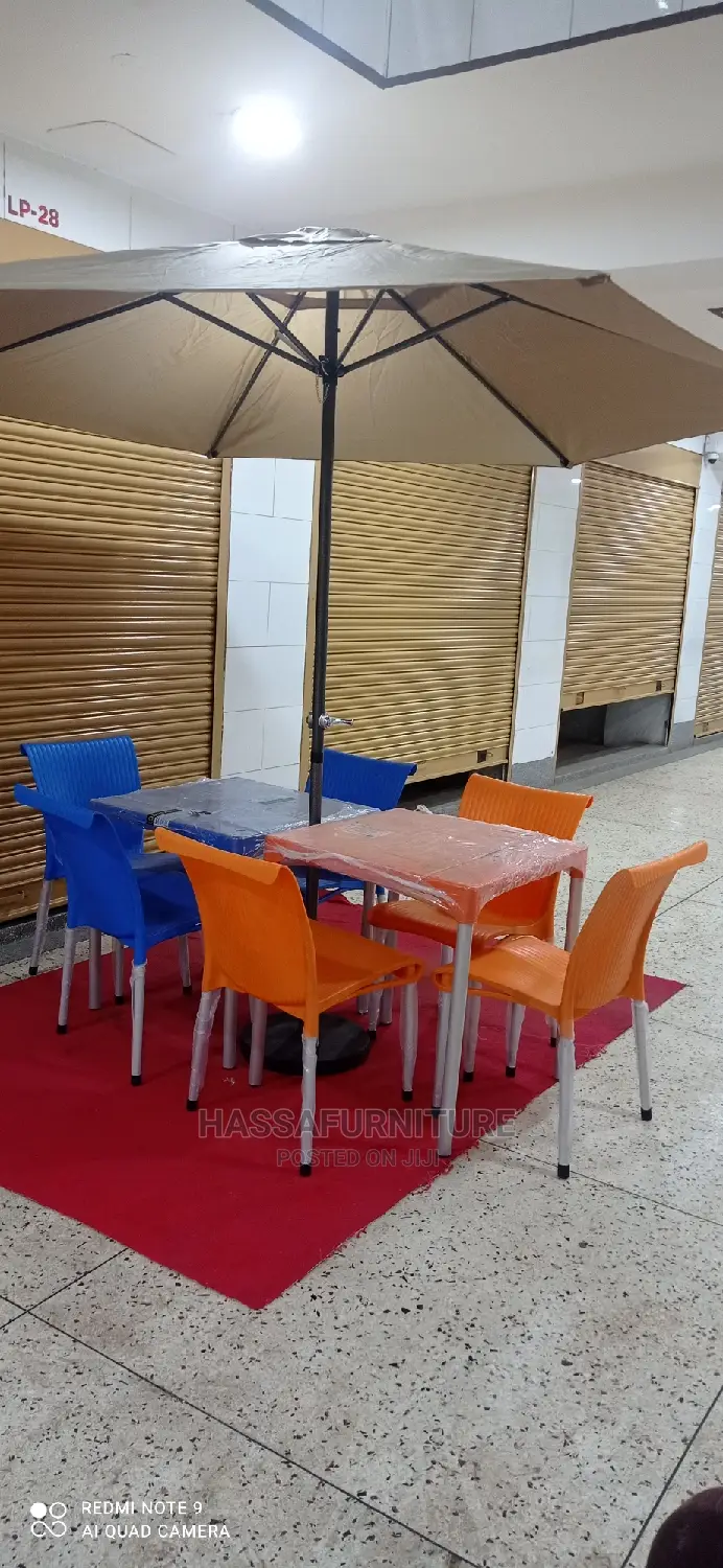 Restaurant Set of Tables and Chairs Plus Umbrella