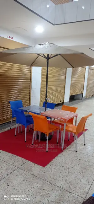 Restaurant Set of Tables and Chairs Plus Umbrella