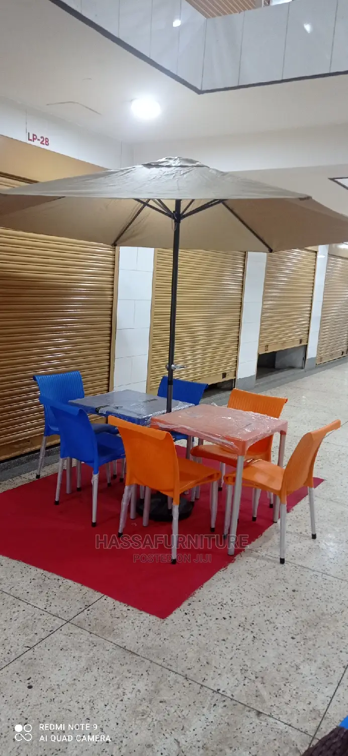 Restaurant Set of Tables and Chairs Plus Umbrella
