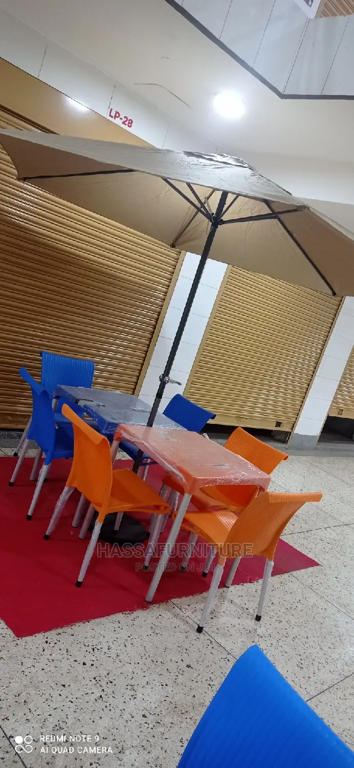 Restaurant Set of Tables and Chairs Plus Umbrella