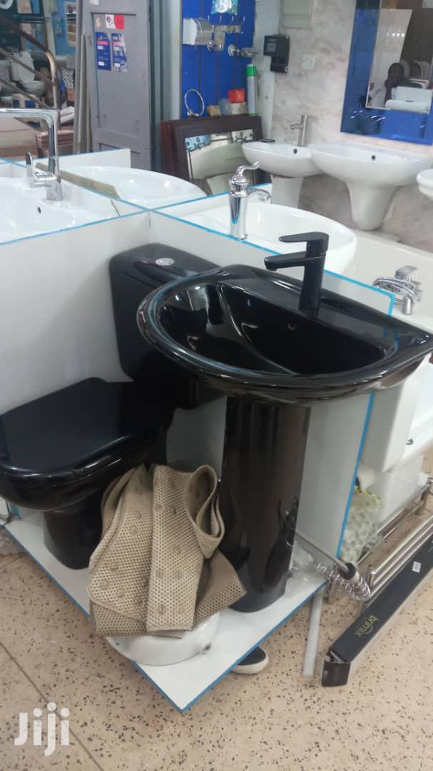 Black Toilet and Wash Hand Basins