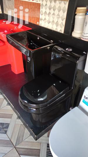 Black Toilet and Wash Hand Basins