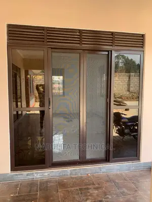 Chocolate Aluminium Front Door With Sliding Nets and Louvers