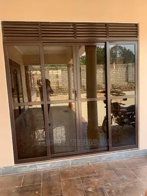 Chocolate Aluminium Front Door With Sliding Nets and Louvers