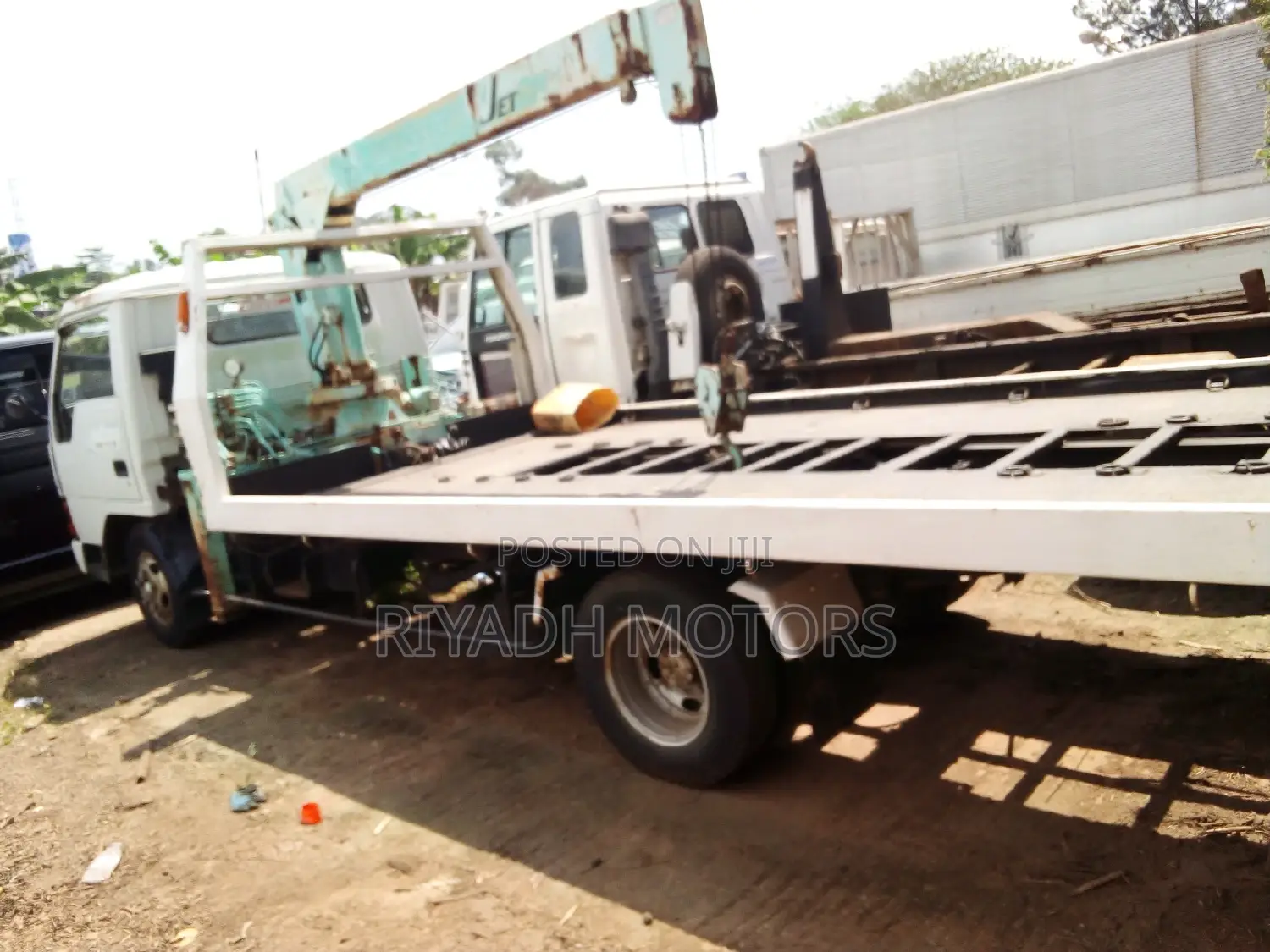 Car Carrier With a Crane