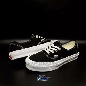 Photo - Original Unisex Black/White Vans Off the Wall Sneakers