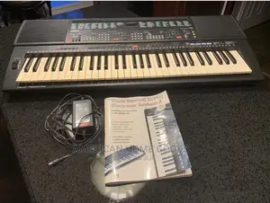 Yamaha PSR-500, 61 Keys Electronic Keyboard With Stand.