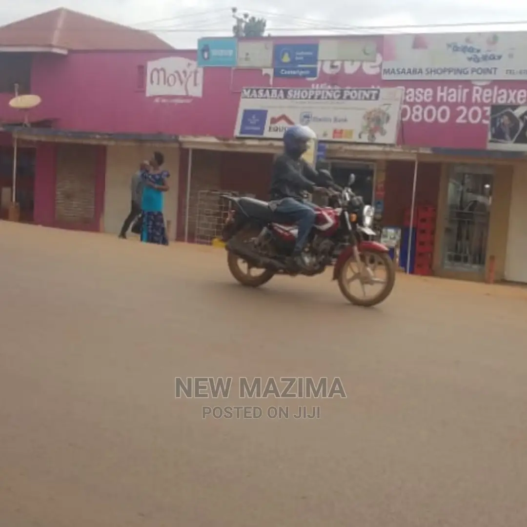 Busy Commercial Shops Measuring Direct on Tarmac of Ntebe Rd