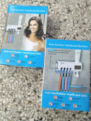 Tooth Brush Sterilizer and Toothpaste Dispenser