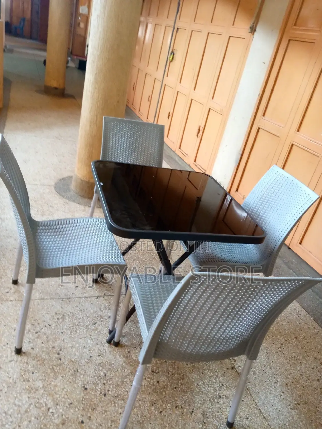 Armless Plastic Chairs and Glass Table Set