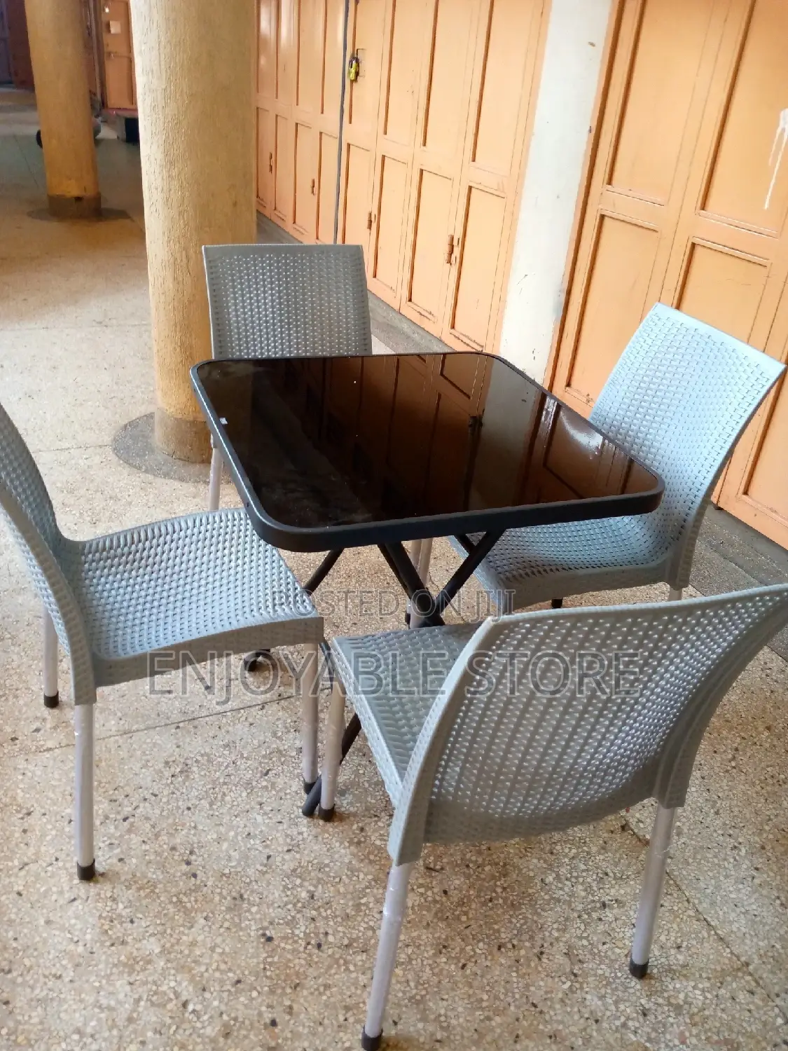 Armless Plastic Chairs and Glass Table Set