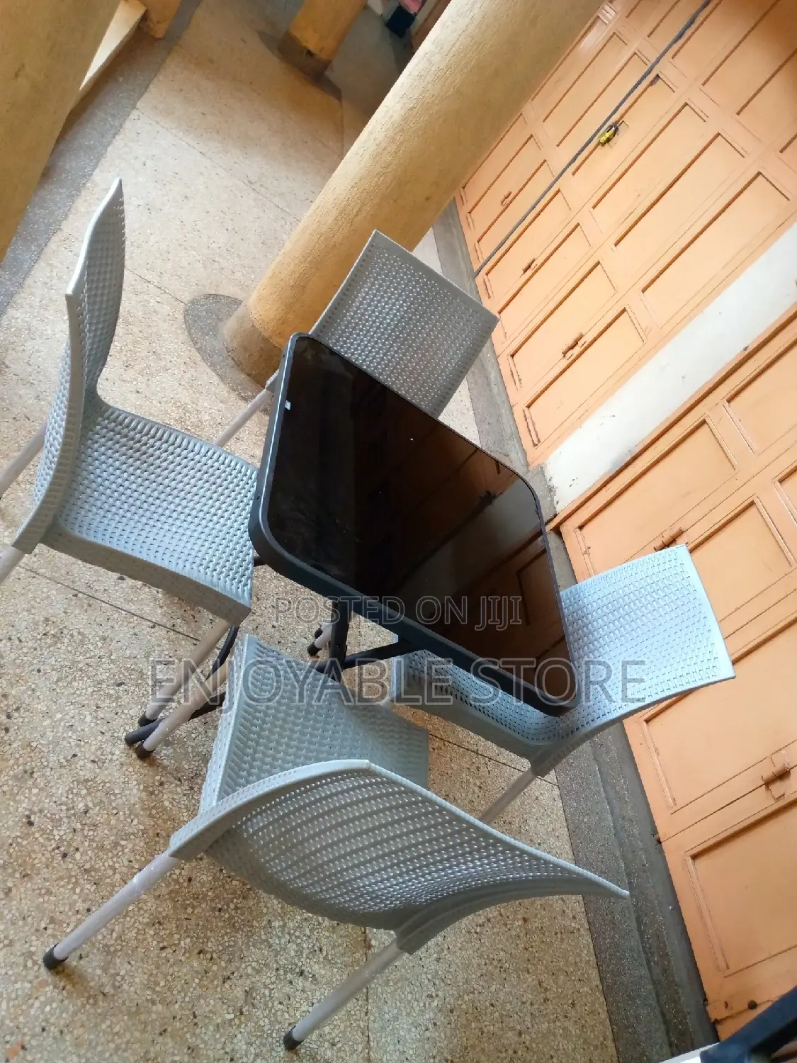 Armless Plastic Chairs and Glass Table Set