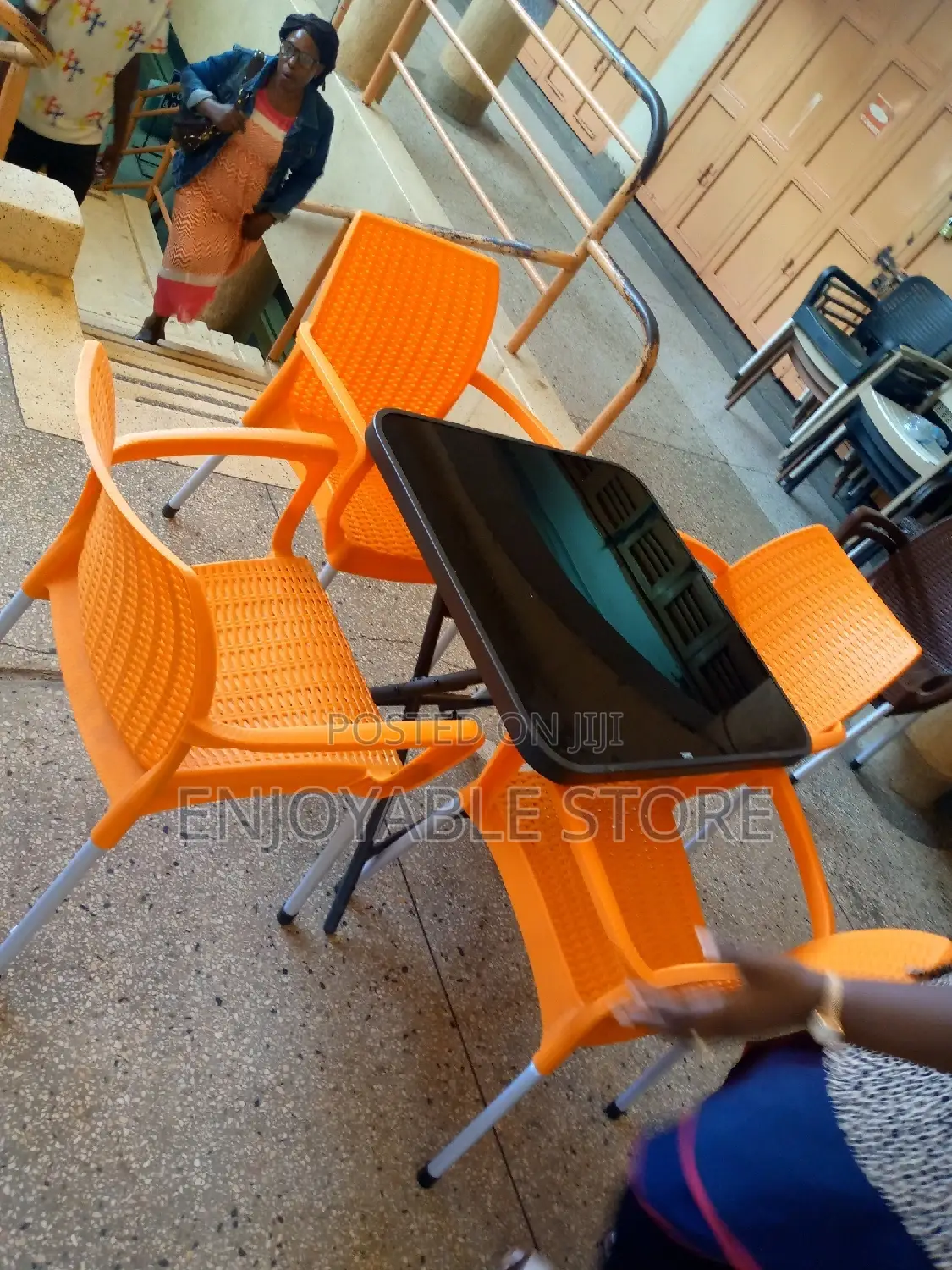 Plastic Chairs and Glass Table Square