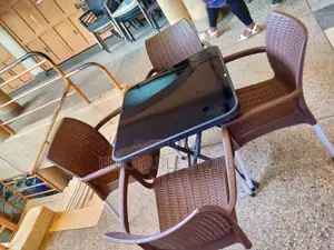 Plastic Chairs and Glass Square Table Set