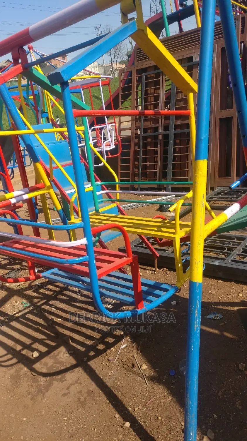 Basket Swing in Central Division Playground Equipment, Derrick Mukasa