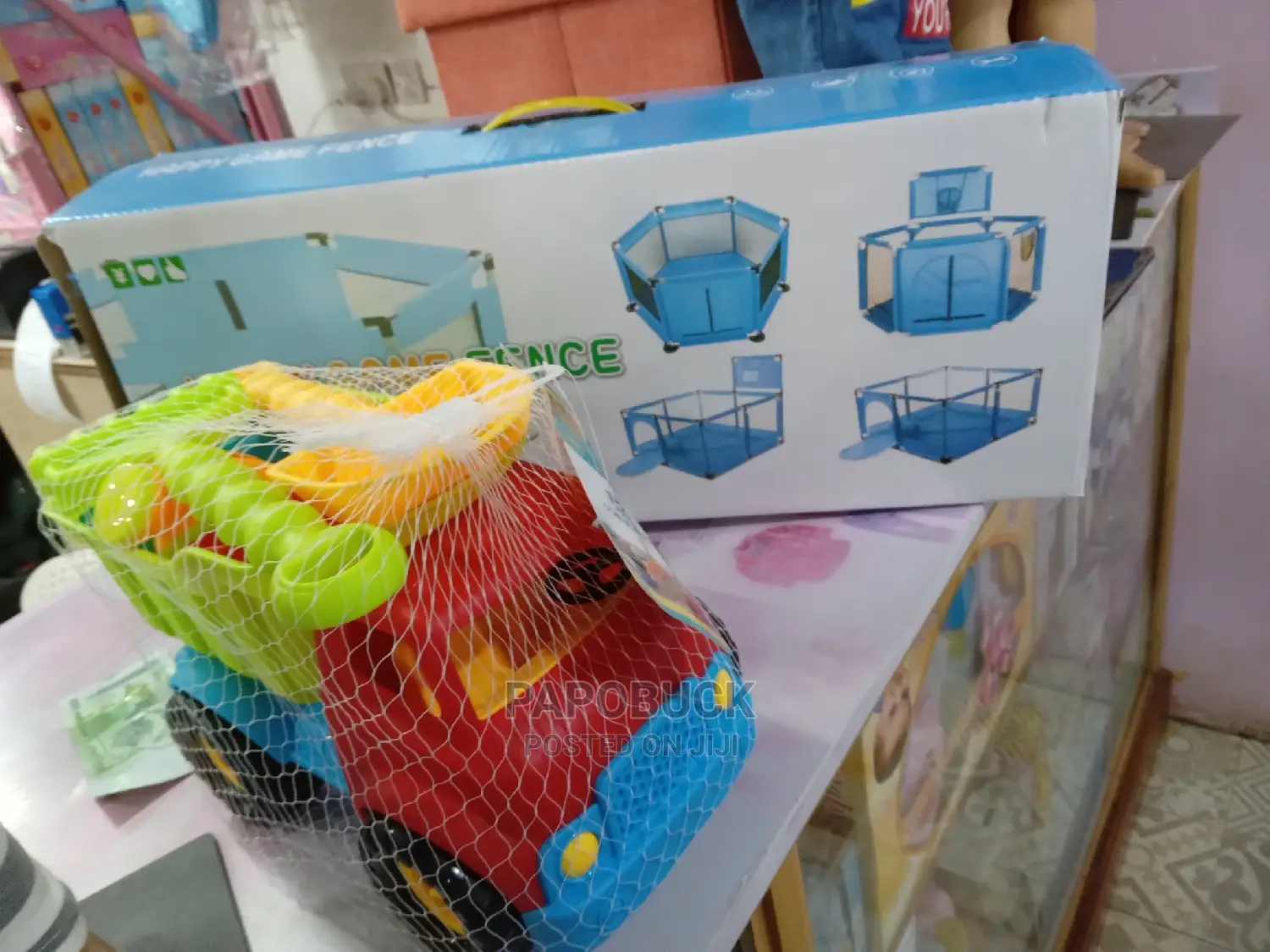 Kids Playpen With Balls and a Toy Car