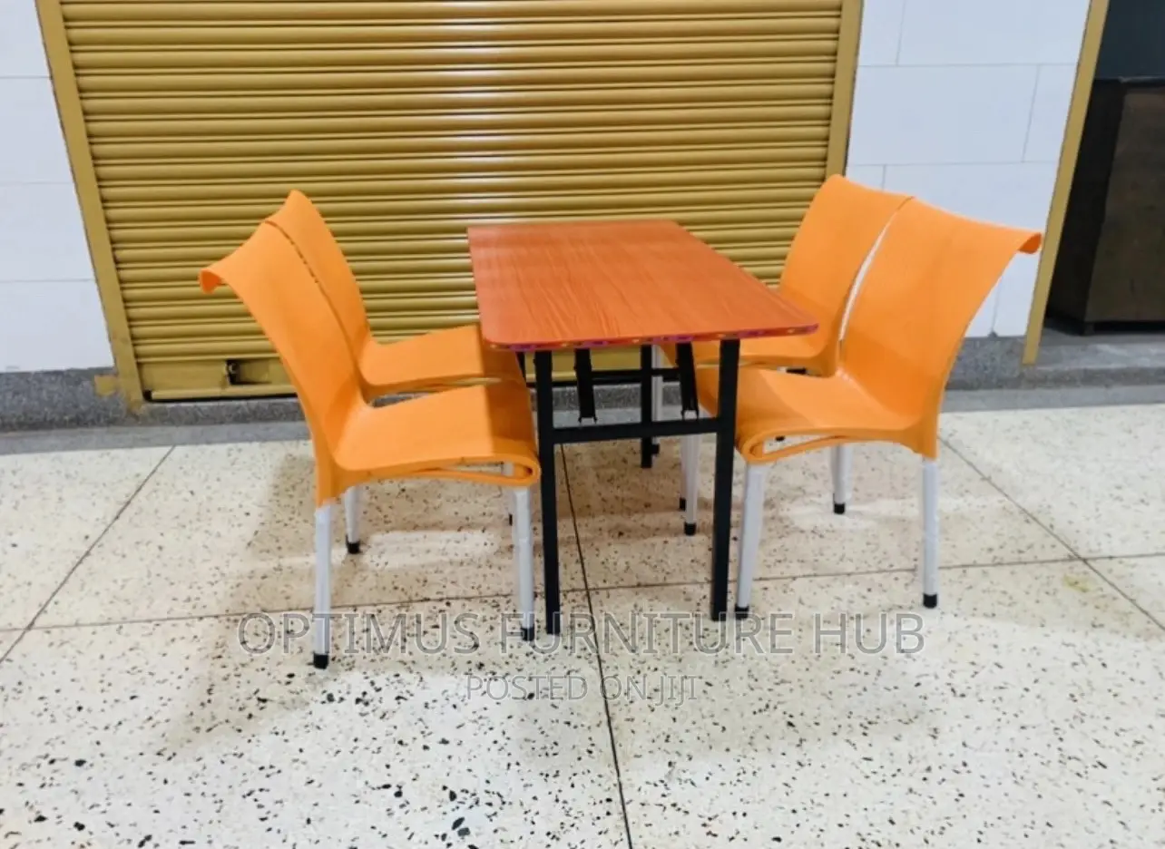 Table and Orange Chairs