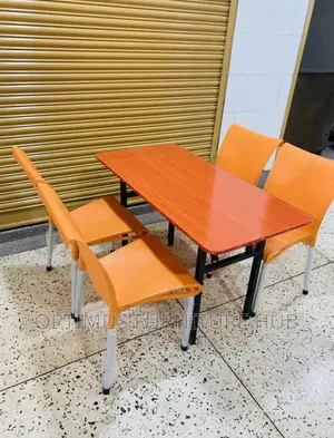 Table and Orange Chairs