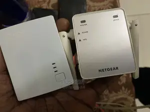 Photo - NETGEAR N300 Wifi Range Extender EX2700 Signal Booster Up To