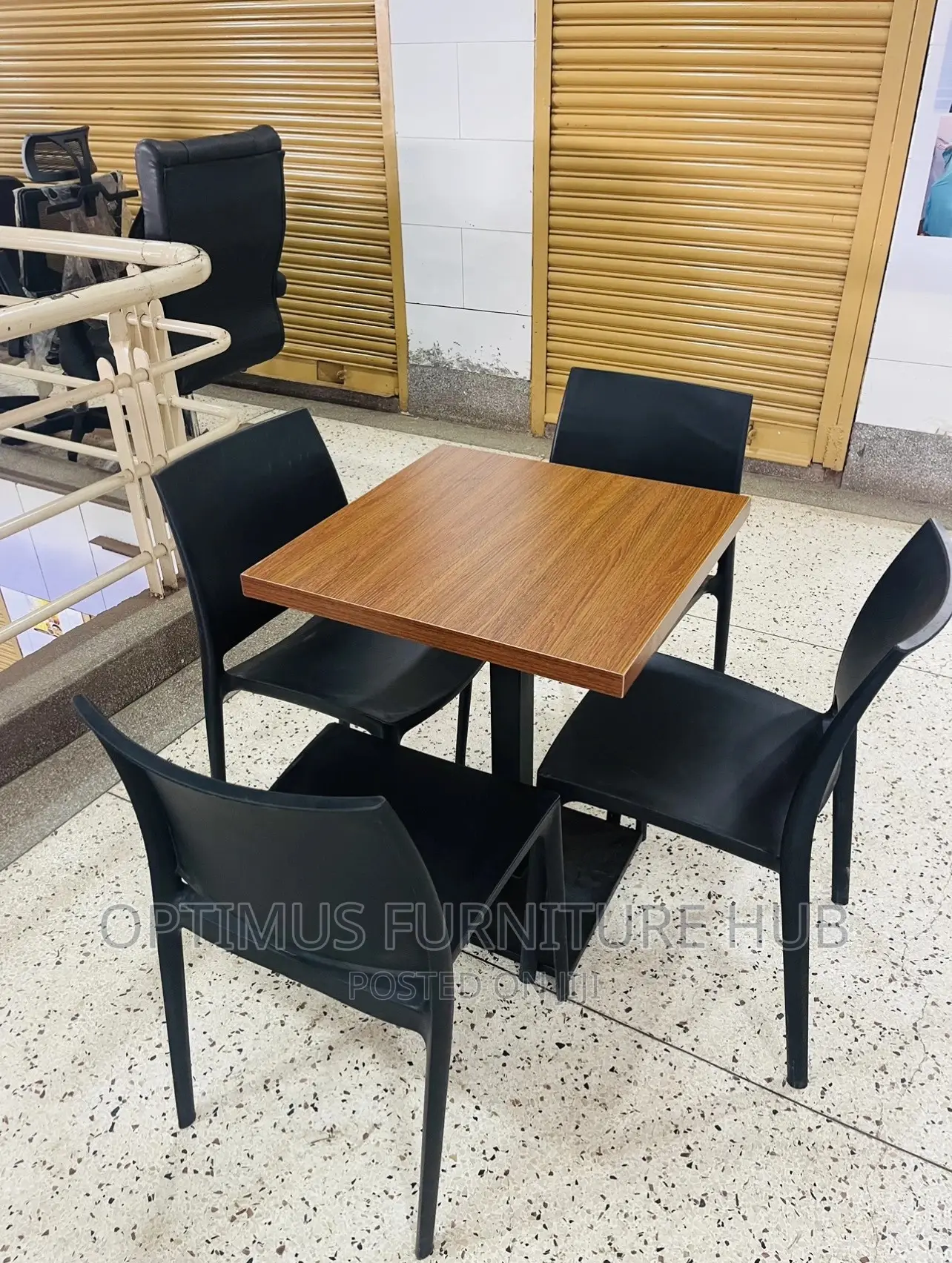 Table and Four Black Chairs