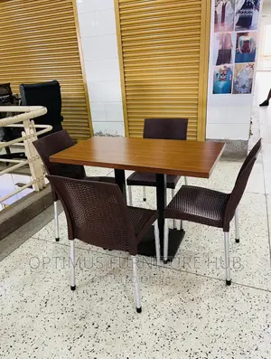 Table and 4 Brown Chairs