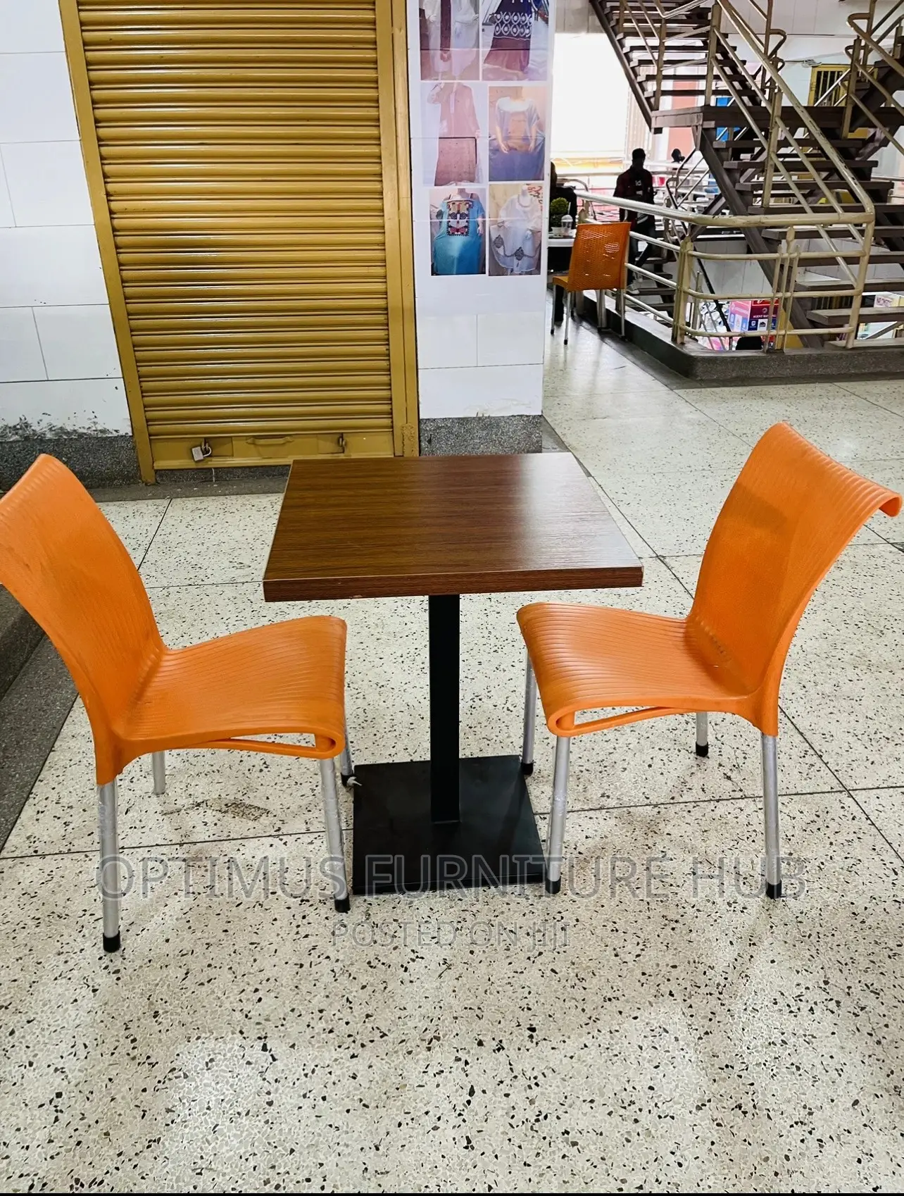 Square Table and Orange Chairs