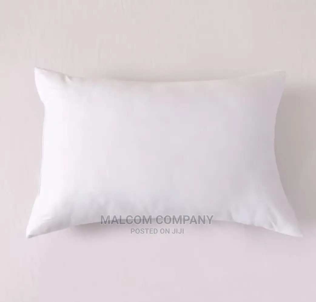 A Pair of Plain White Fibre Pillows