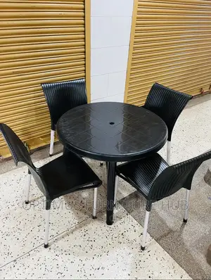 Table and Plastic Chairs