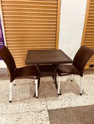 Two Brown Chairs and Table