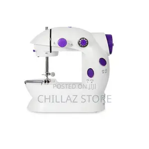 Photo - Mini Electric Sewing Machine.