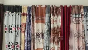 A Pair of Curtains With Buttons