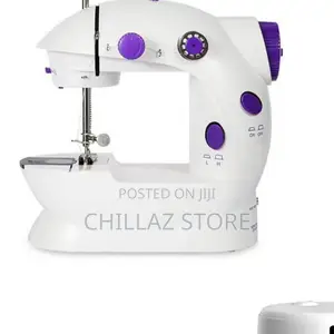 Photo - Mini Portable Electric Sewing Machine.