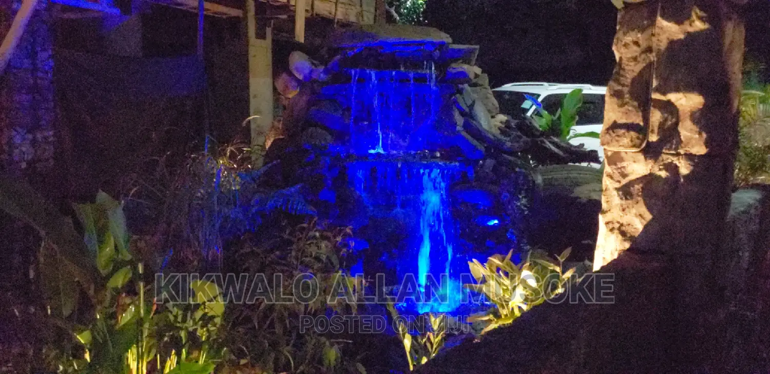 Waterfall, Fountain, Antique Bolders, Rock Garden Services.