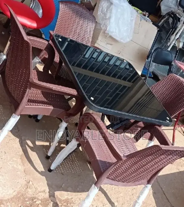 Plastic Chairs and Glass Table