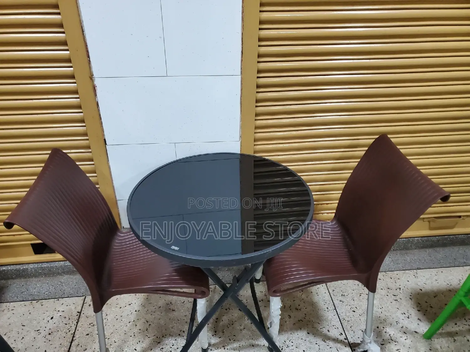 Plastic Chairs and Glass Table