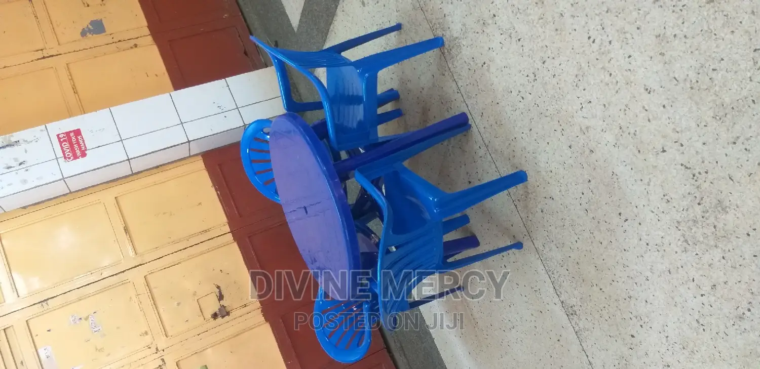 Aset of Plastic Tables and Armed Chairs