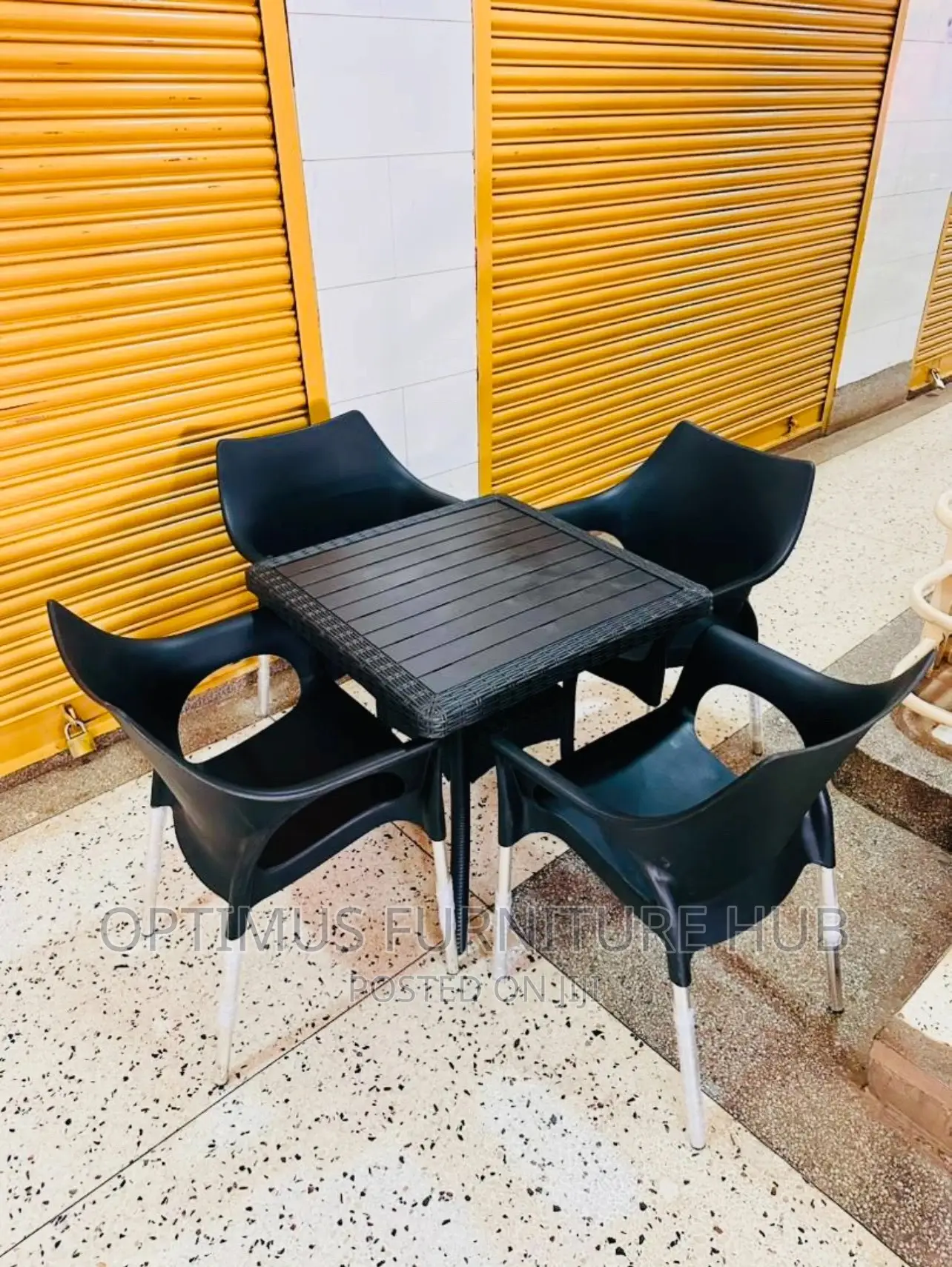 Table and Four Plastic Chair