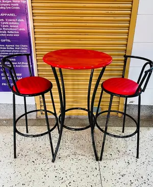 Photo - Two Red Chairs and Table