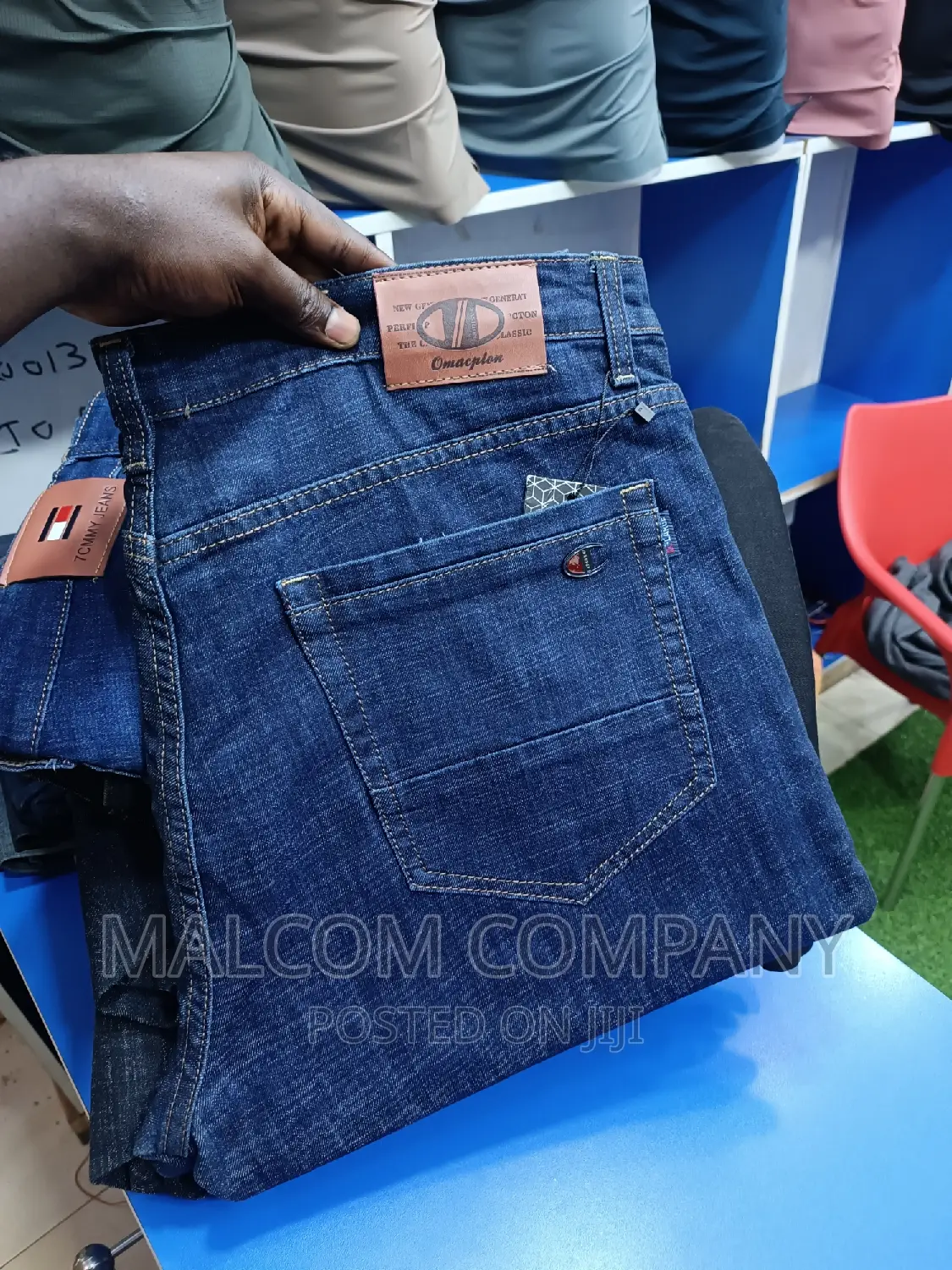 Men Stretching Blue Jeans Size 42