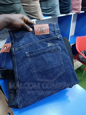 Photo - Men Stretching Blue Jeans Size 42