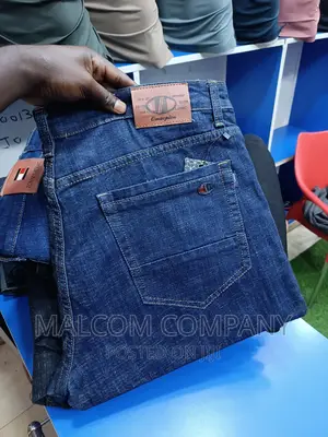 Men Stretching Blue Jeans Size 42
